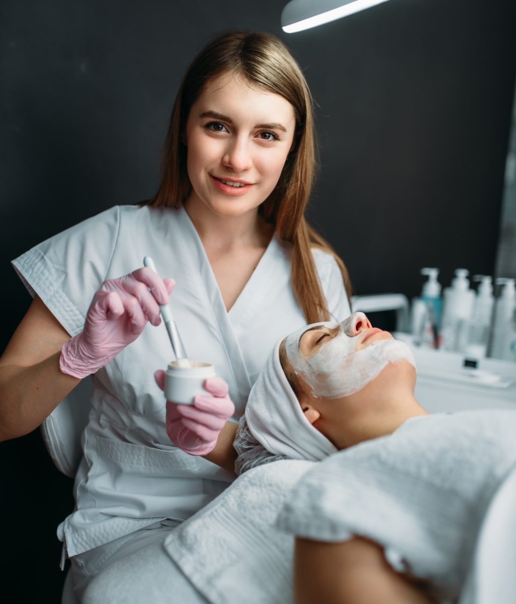 female-doctor-holds-cream-and-brush-in-hands.jpg